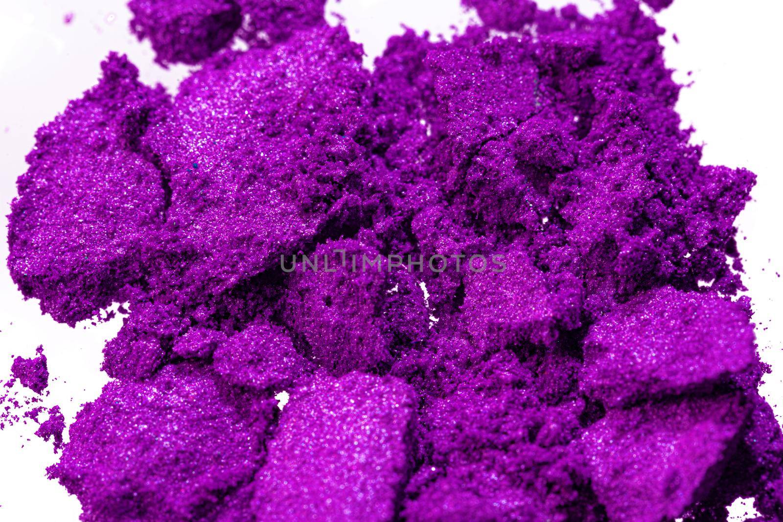 Smashed eyeshadows of bright purple color, make up concept