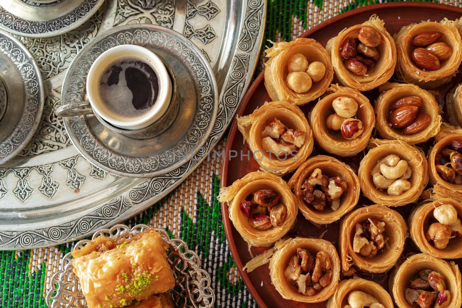 Traditional arabic dessert baklava with a cup of turkish coffee, close up