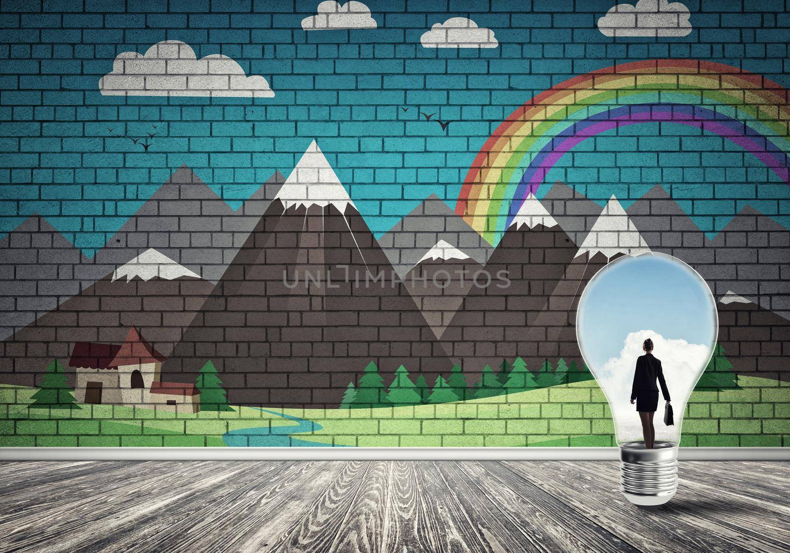 Businesswoman inside light bulb in room against nature drawn concept