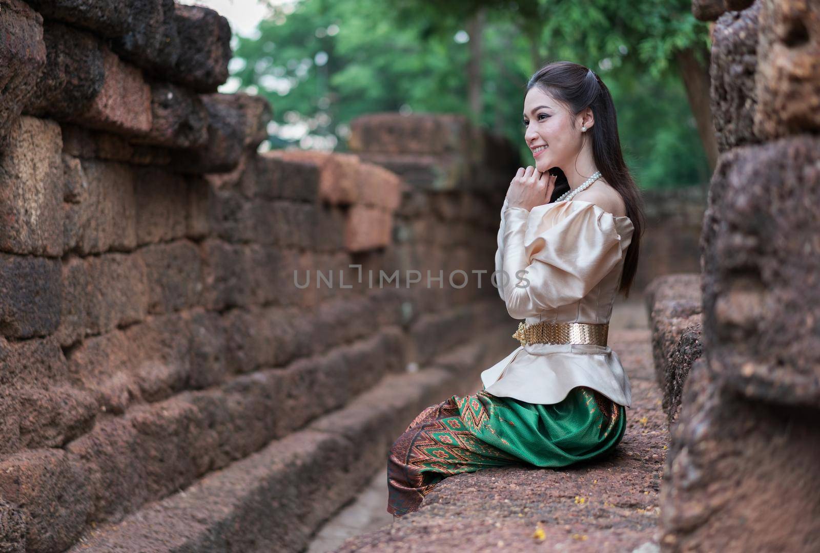 happy beautiful woman in Thai traditional dress 