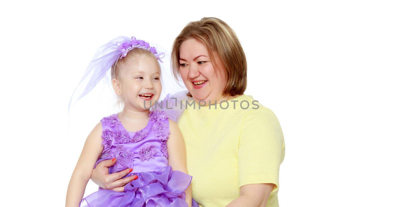 Young blonde mother, gently hugs her favorite little round-faced daughter. Family Idyll.Isolated on white background.