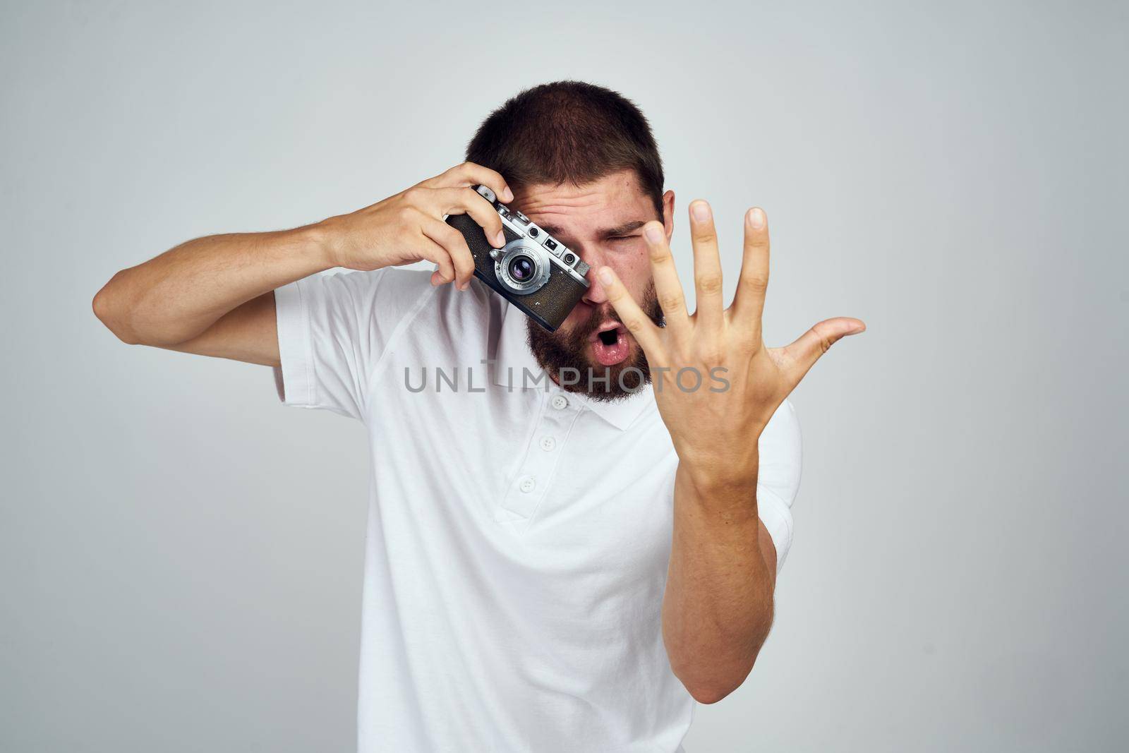 male photographer in glasses with a camera professionals modern style. High quality photo
