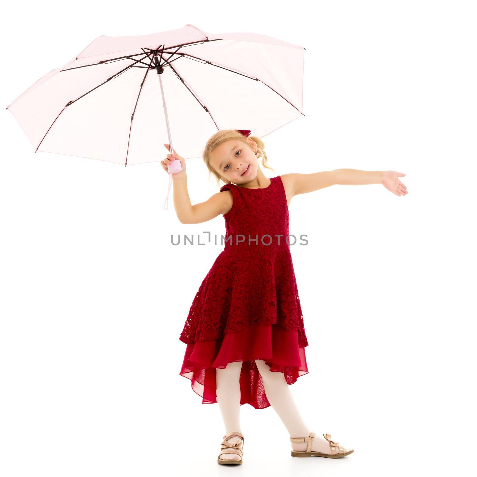 A beautiful little girl hid under an umbrella. The concept of summer vacation, style and fashion. Isolated on white background.