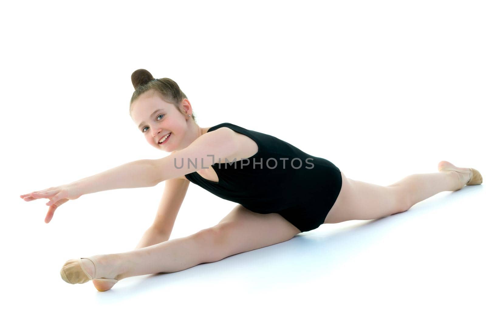The gymnast perform an acrobatic element on the floor. by kolesnikov_studio