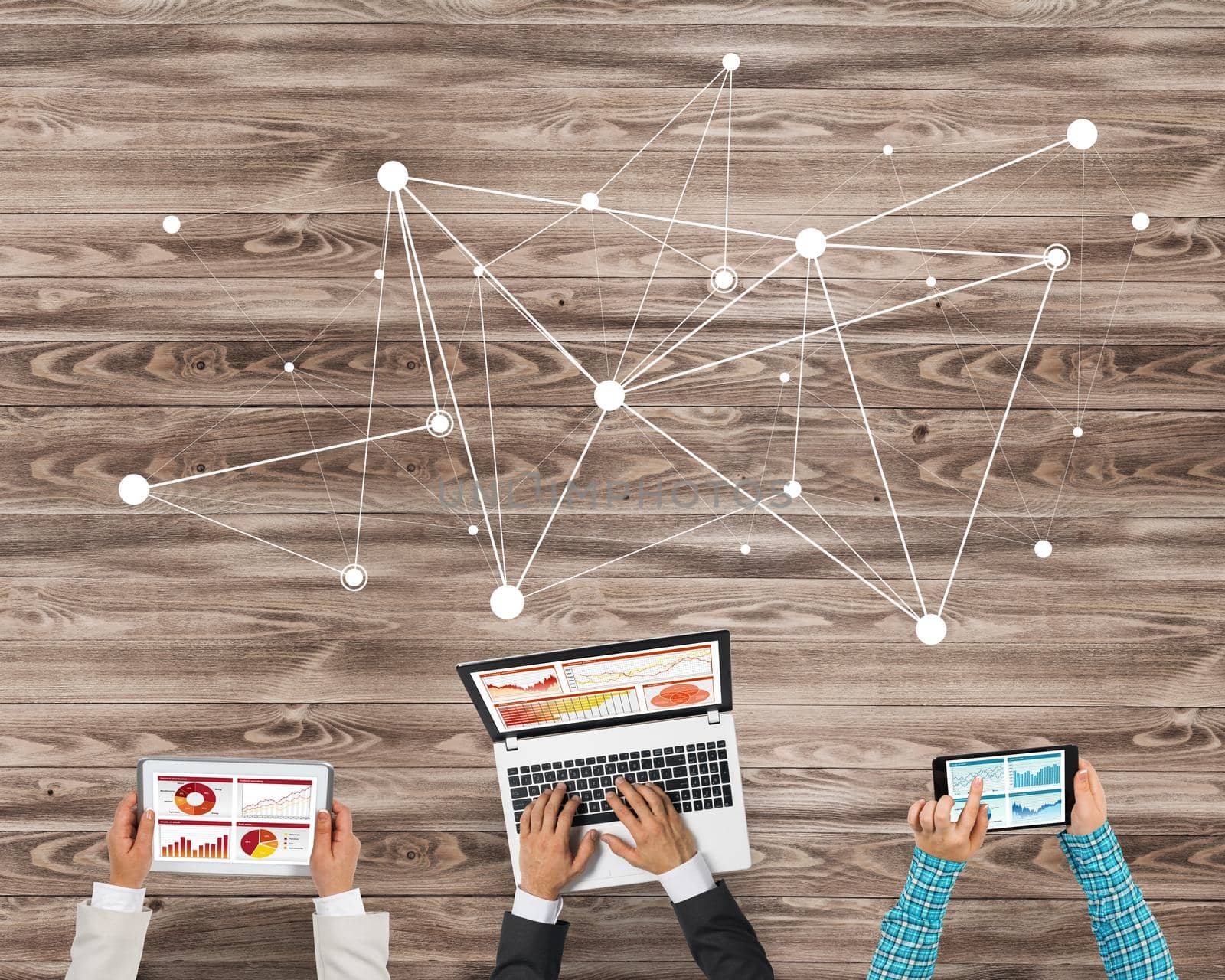 Group of three people with devices in hands working together as symbol of networking and communication