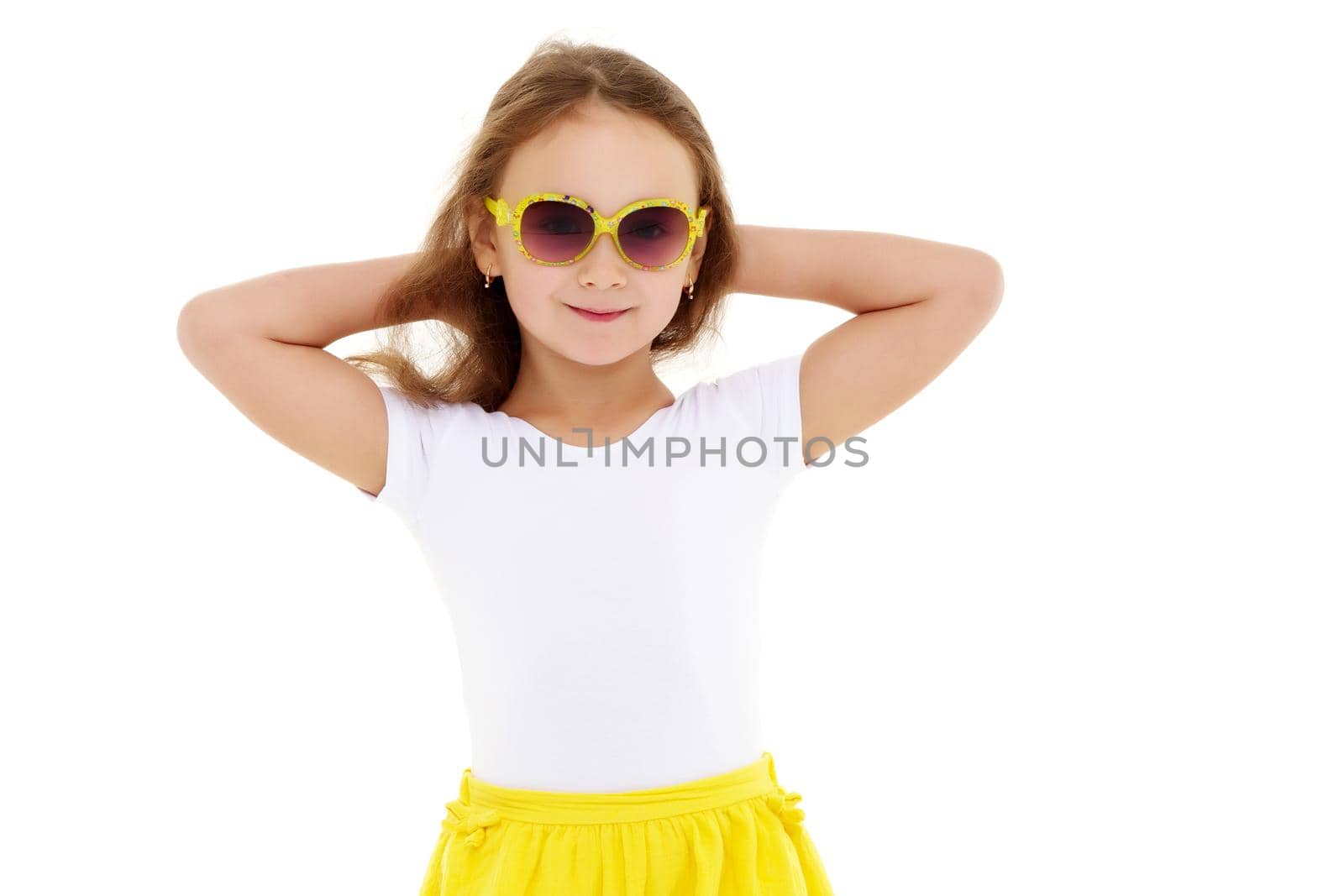 Fashionable little girl in sunglasses. The concept of outdoor recreation, tourism. Isolated on white background.