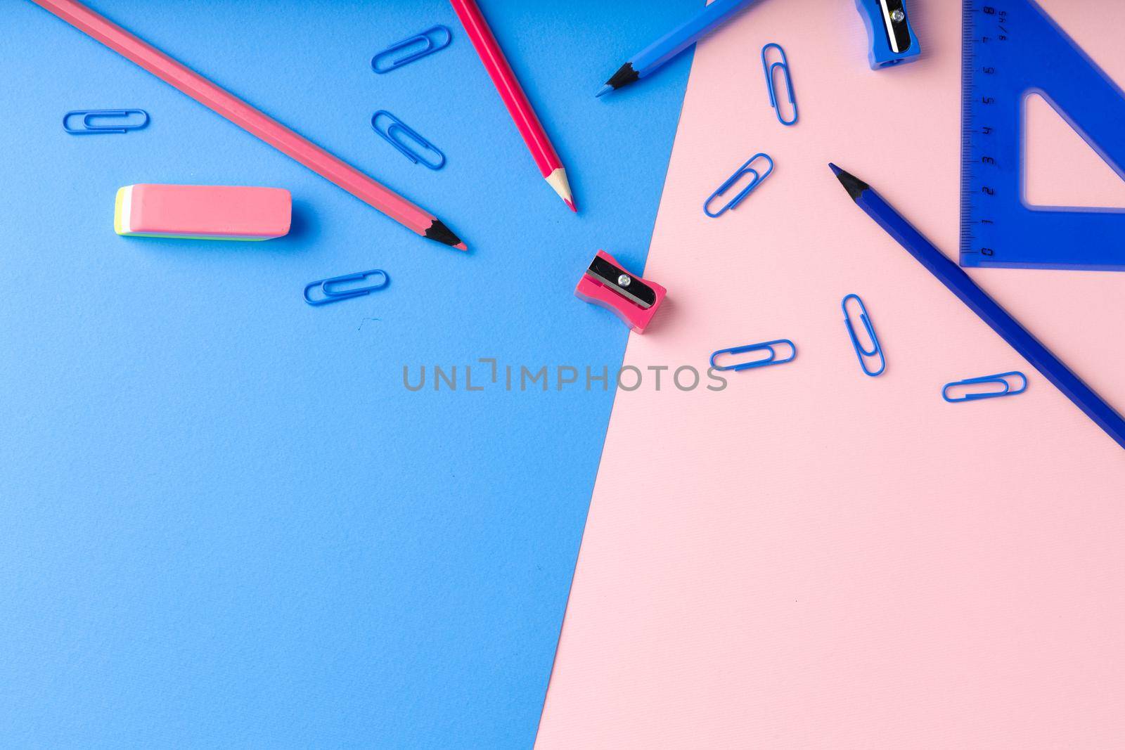 Back to school. Scattered stationery on paper background top view