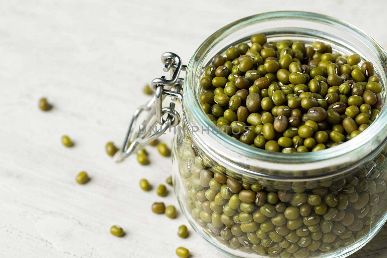 Raw cereals or beans in glass jars close up. Vegan and vegetarian food. Close up.