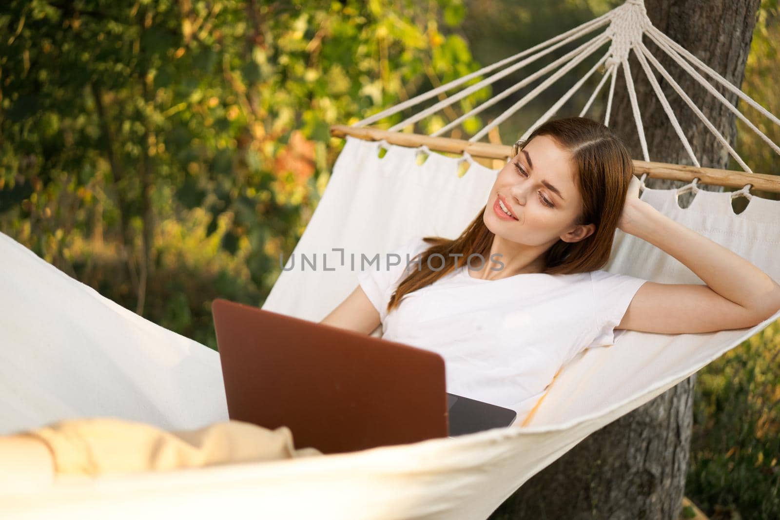 woman love with laptop on nature vacation work travel. High quality photo