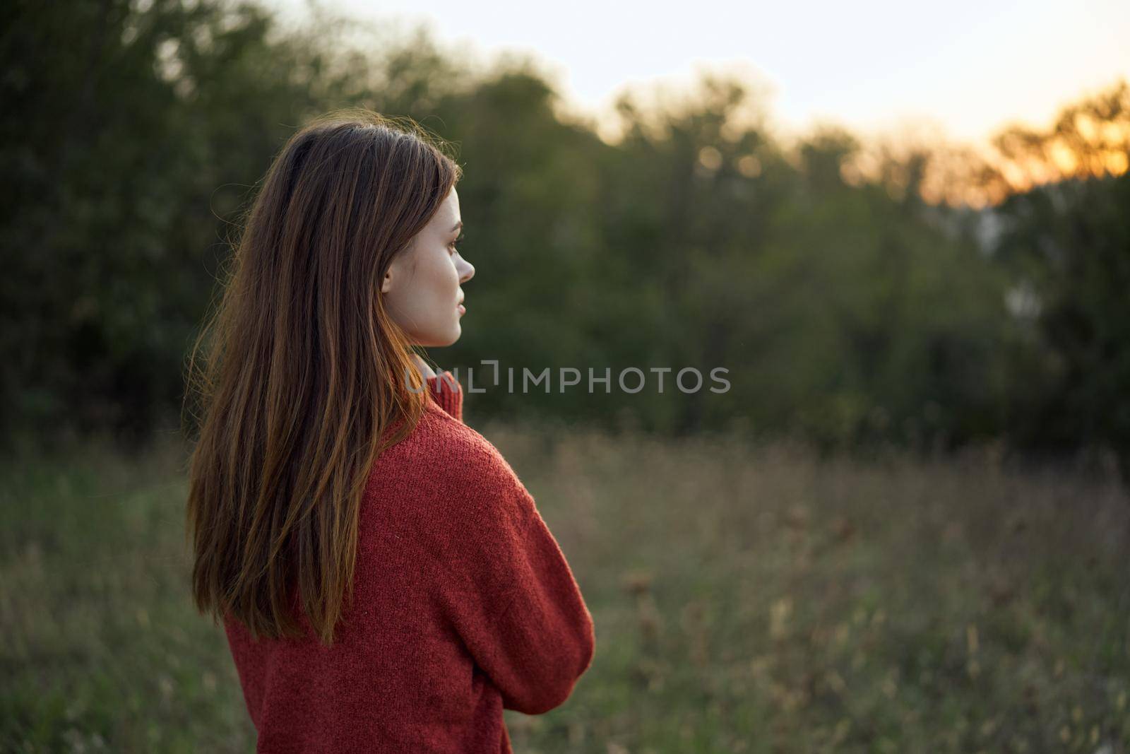 woman outdoors in a field walk fresh air. High quality photo