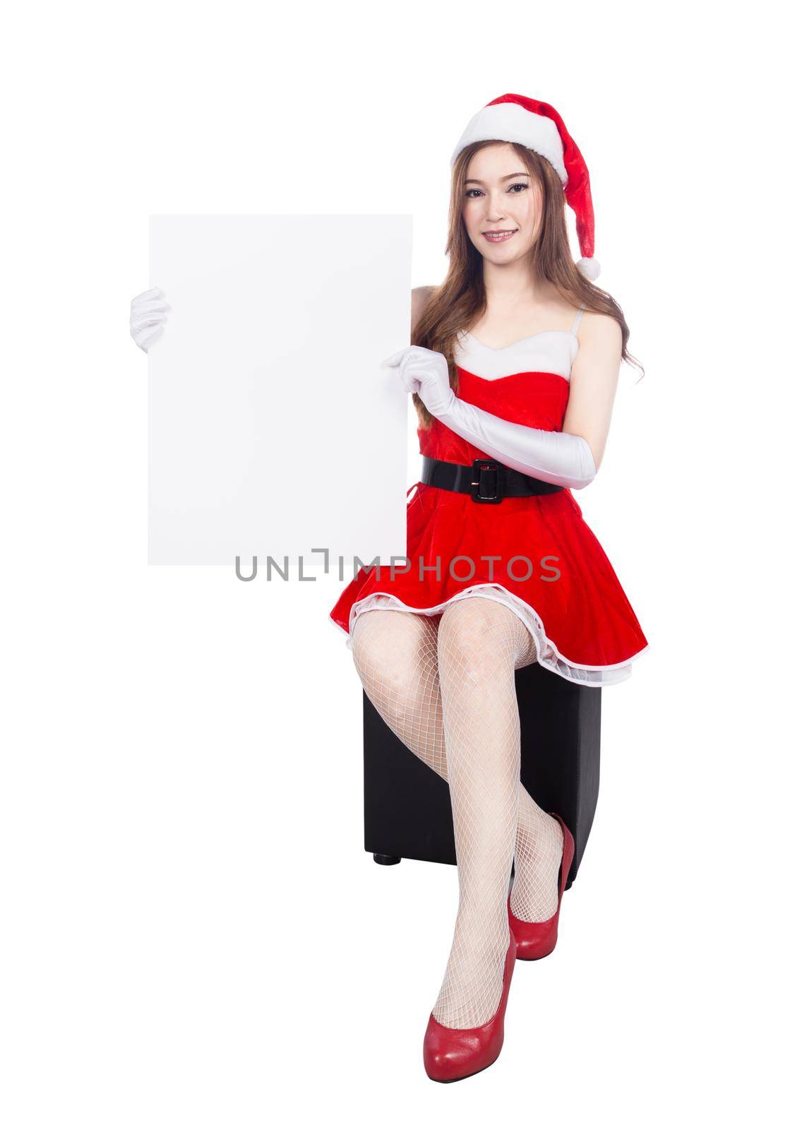 beautiful sexy woman wearing santa claus clothes with blank sign isolated on white background