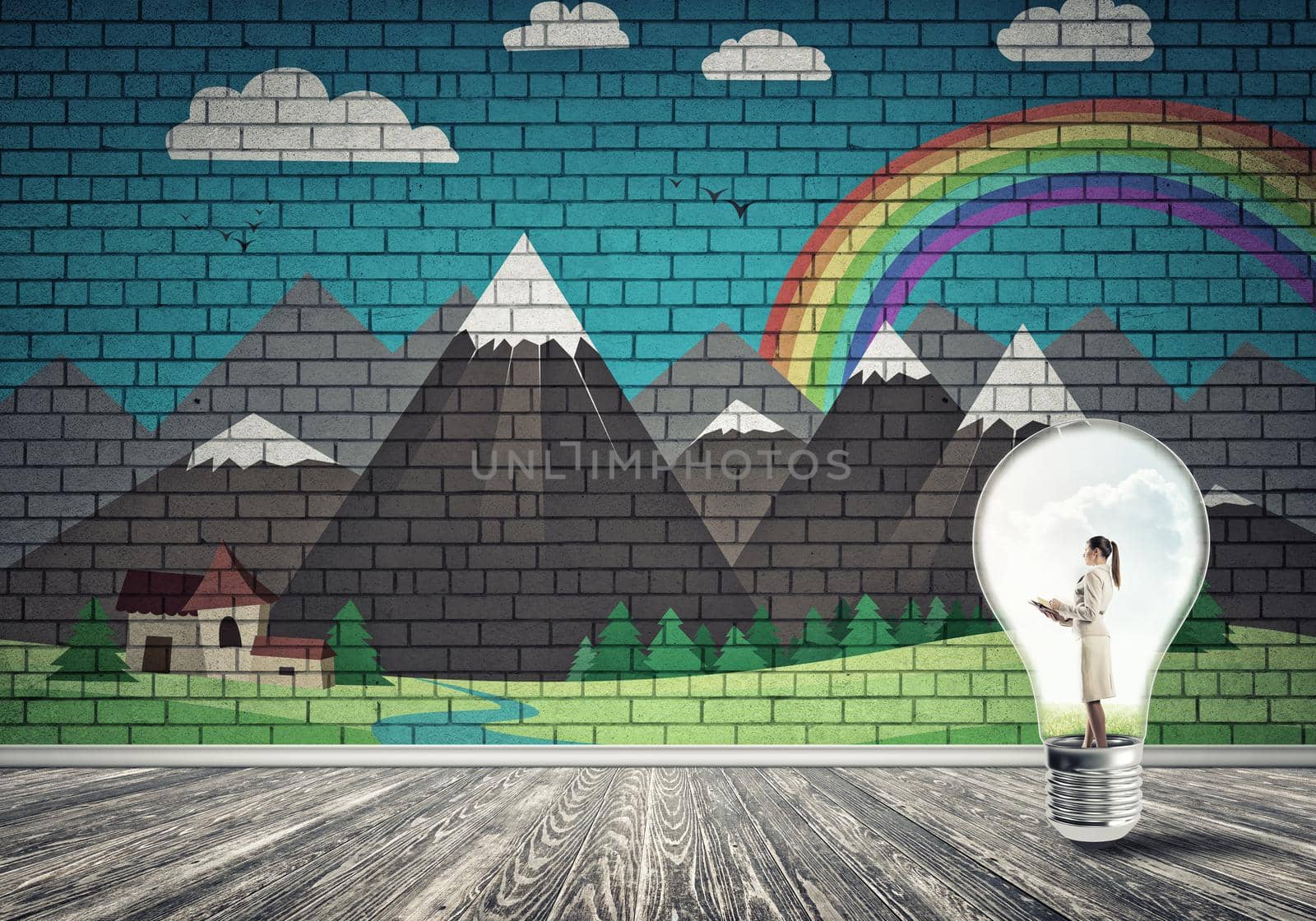 Businesswoman inside light bulb against city drawn concept