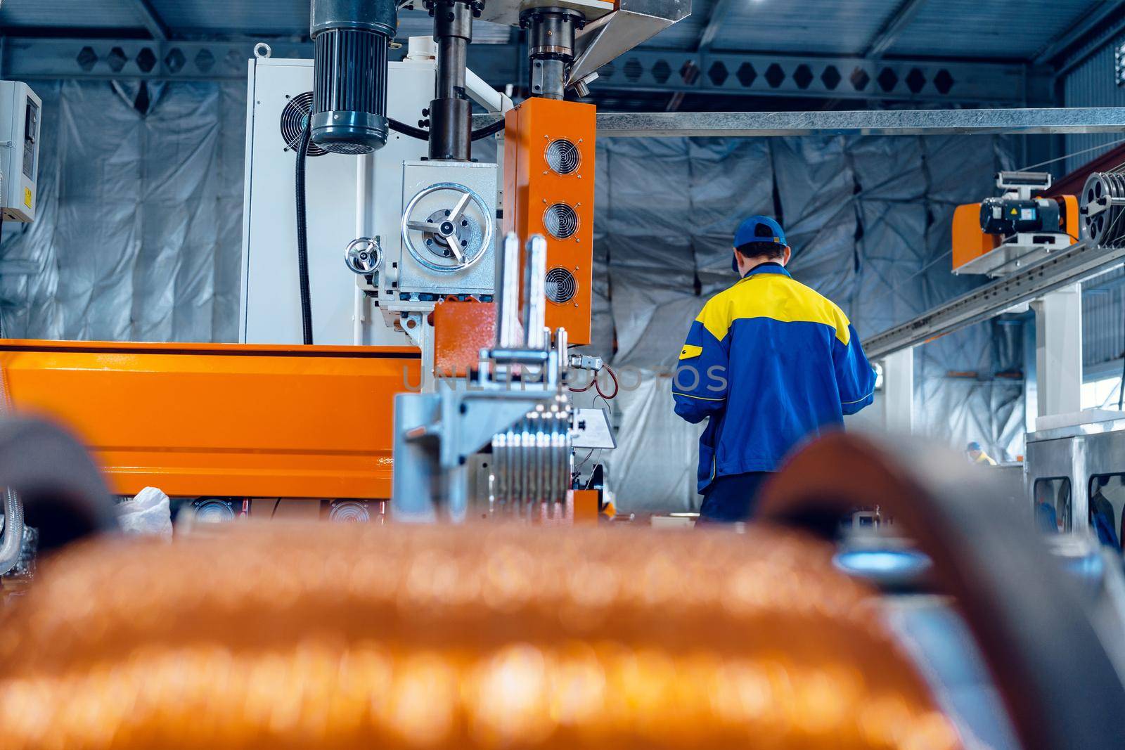 Production of copper wire, cable in reels at factory. Cable factory. Close up.