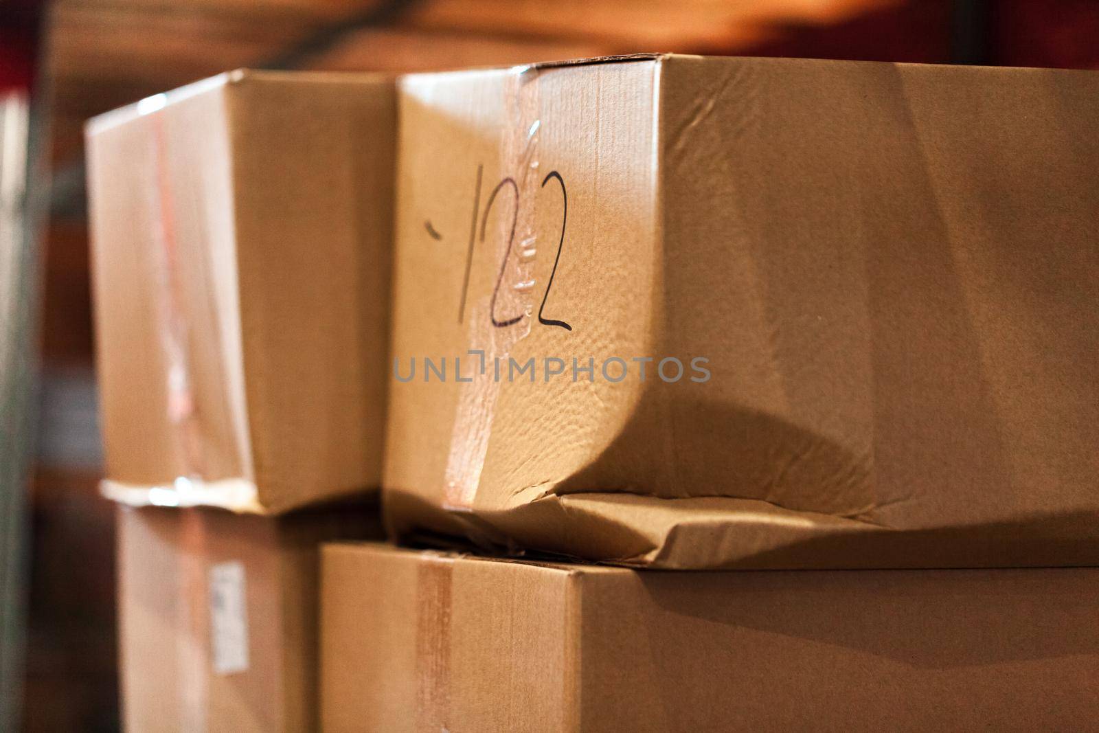 Modern warehouse shelves with pile of cardboard boxes. Close up.