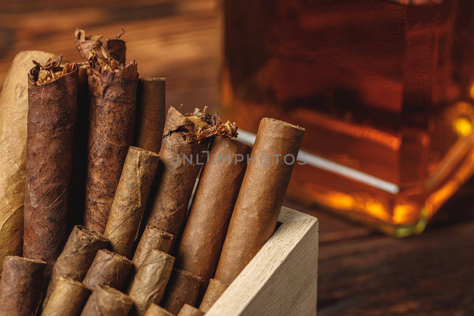Pile of new cuban cigars close up on wooden table