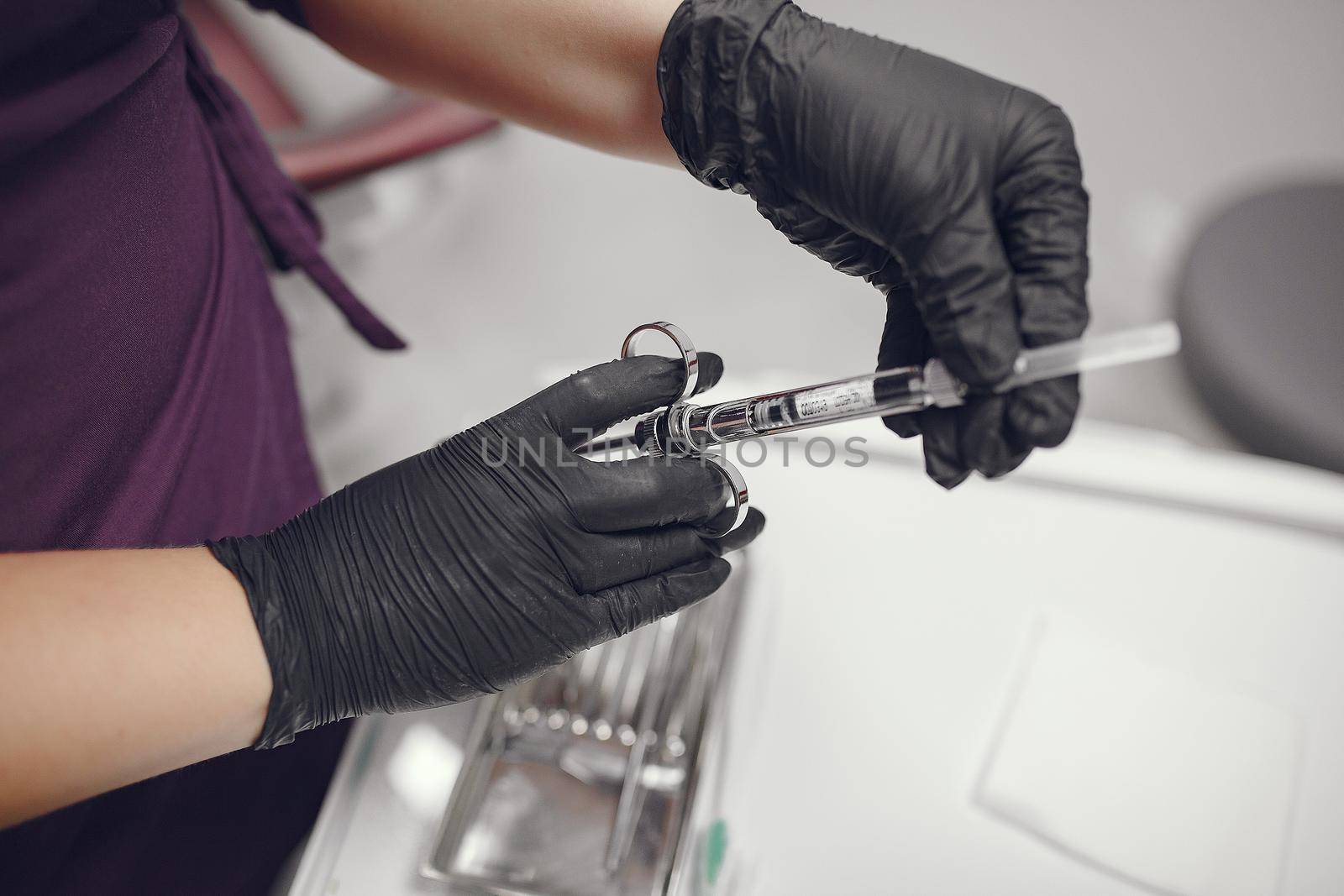 Tools in a hands. Dentist holds instruments