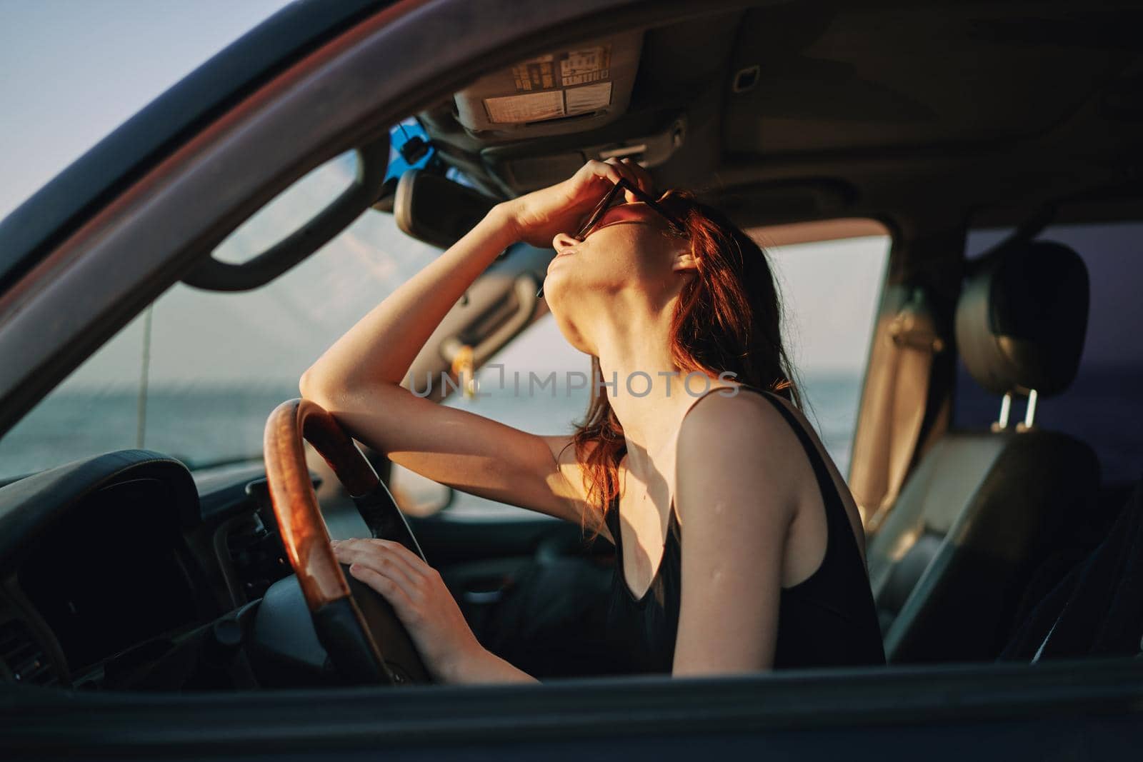 woman driving in car trip posing fashion travel. High quality photo