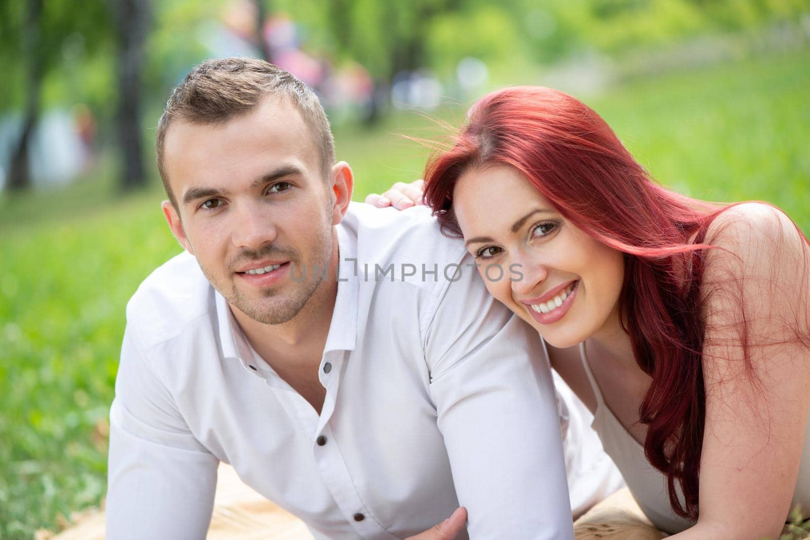 Young couple on a date in the park by adam121