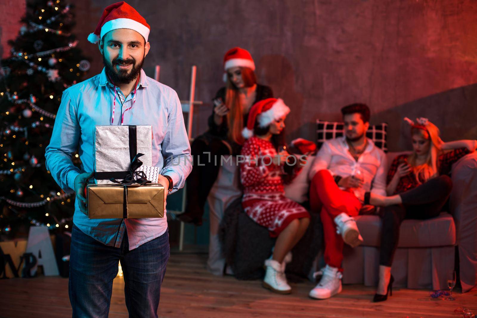 Christmas, x-mas, New year, winter, happiness concept - smiling man in santa helper hat with gift boxes by nazarovsergey
