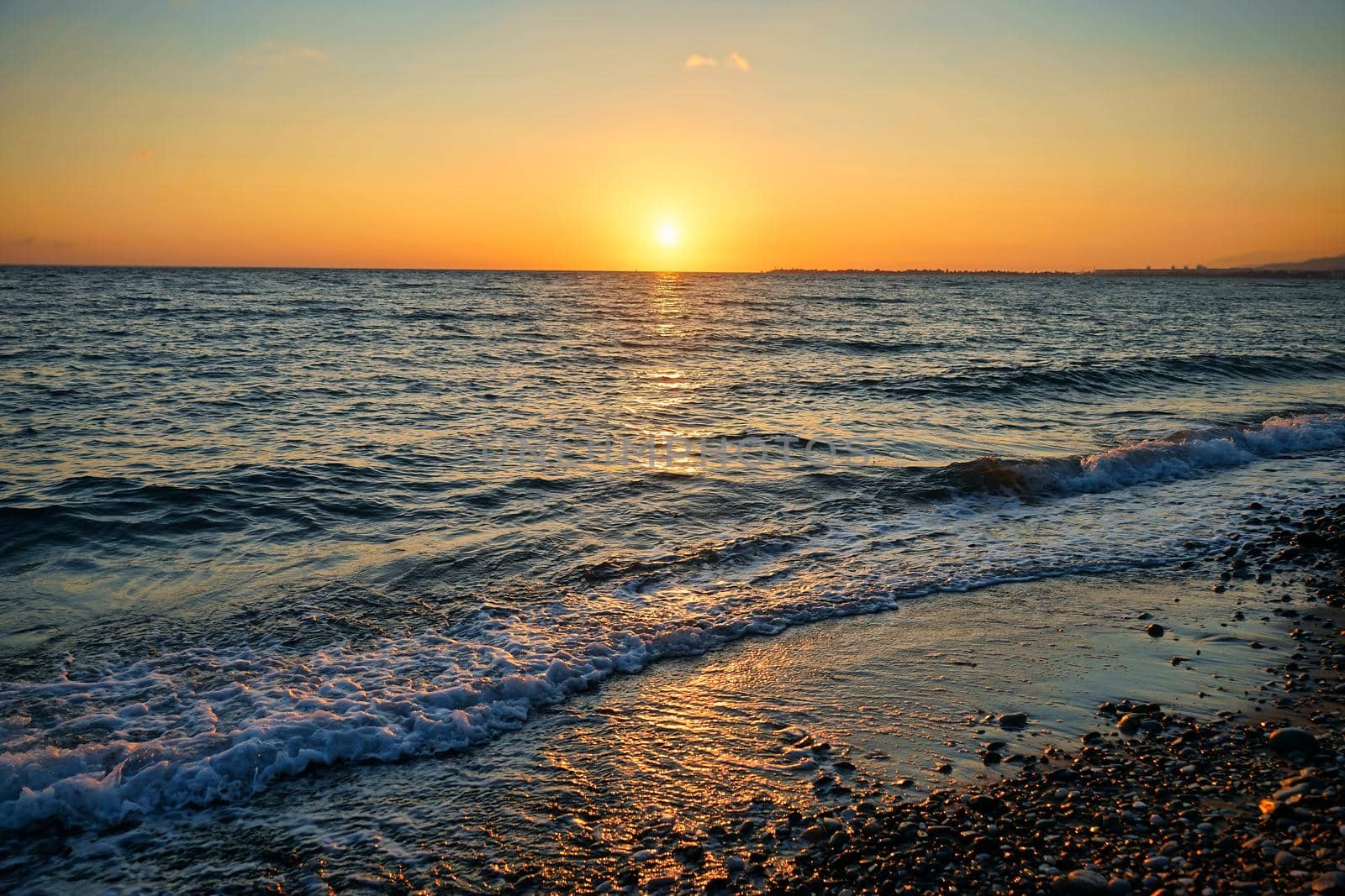 seascape with a beautiful sunset on the background of the sea.