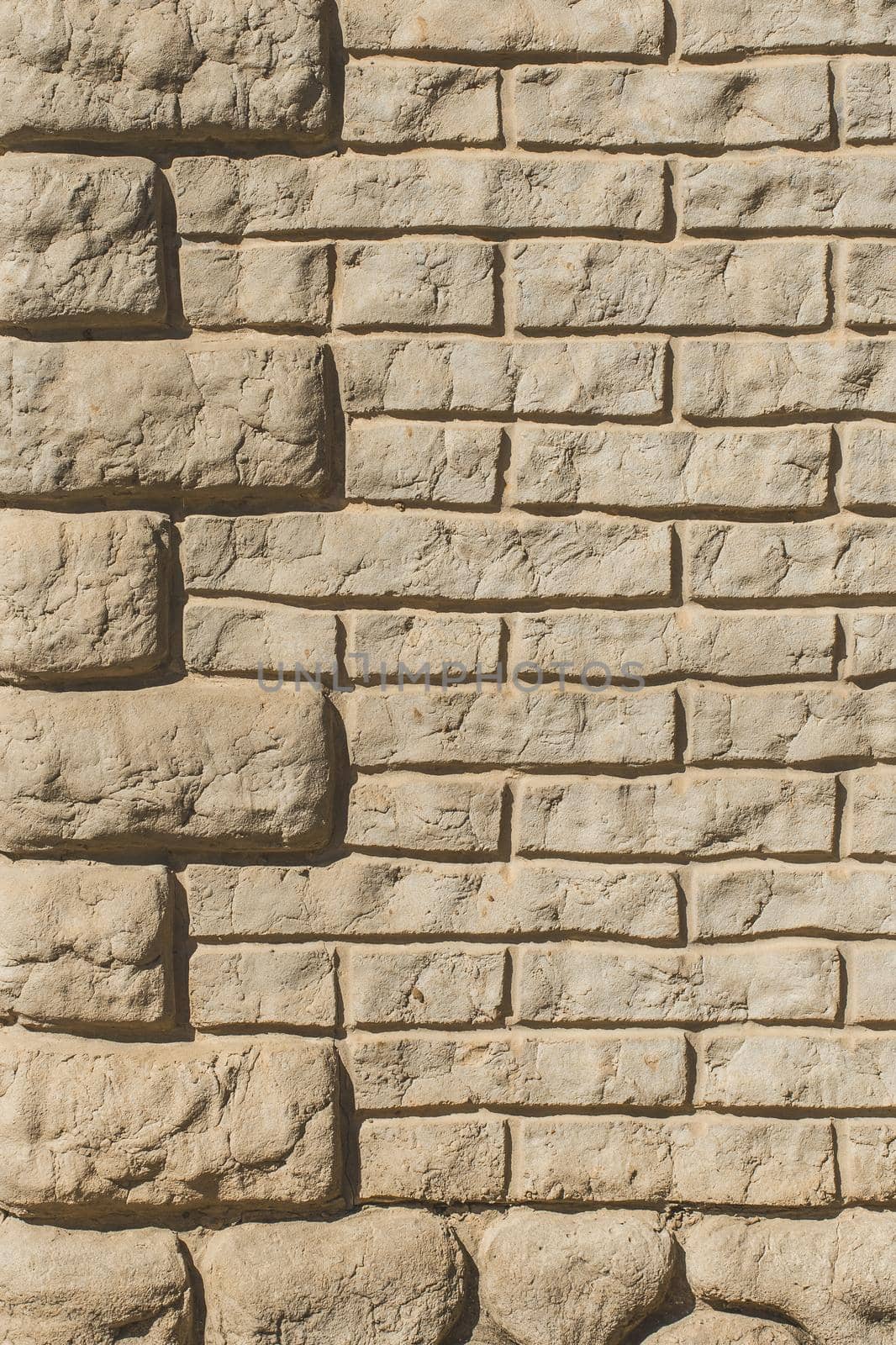 Modern clay brick wall texture, sand stone building facade background.