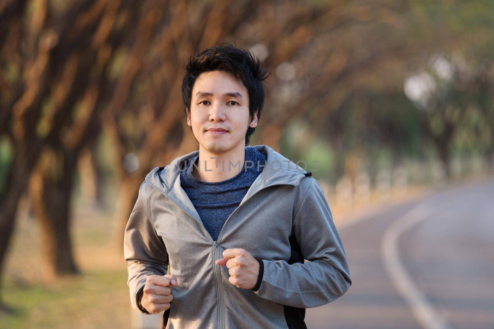 fitness man running in park by geargodz