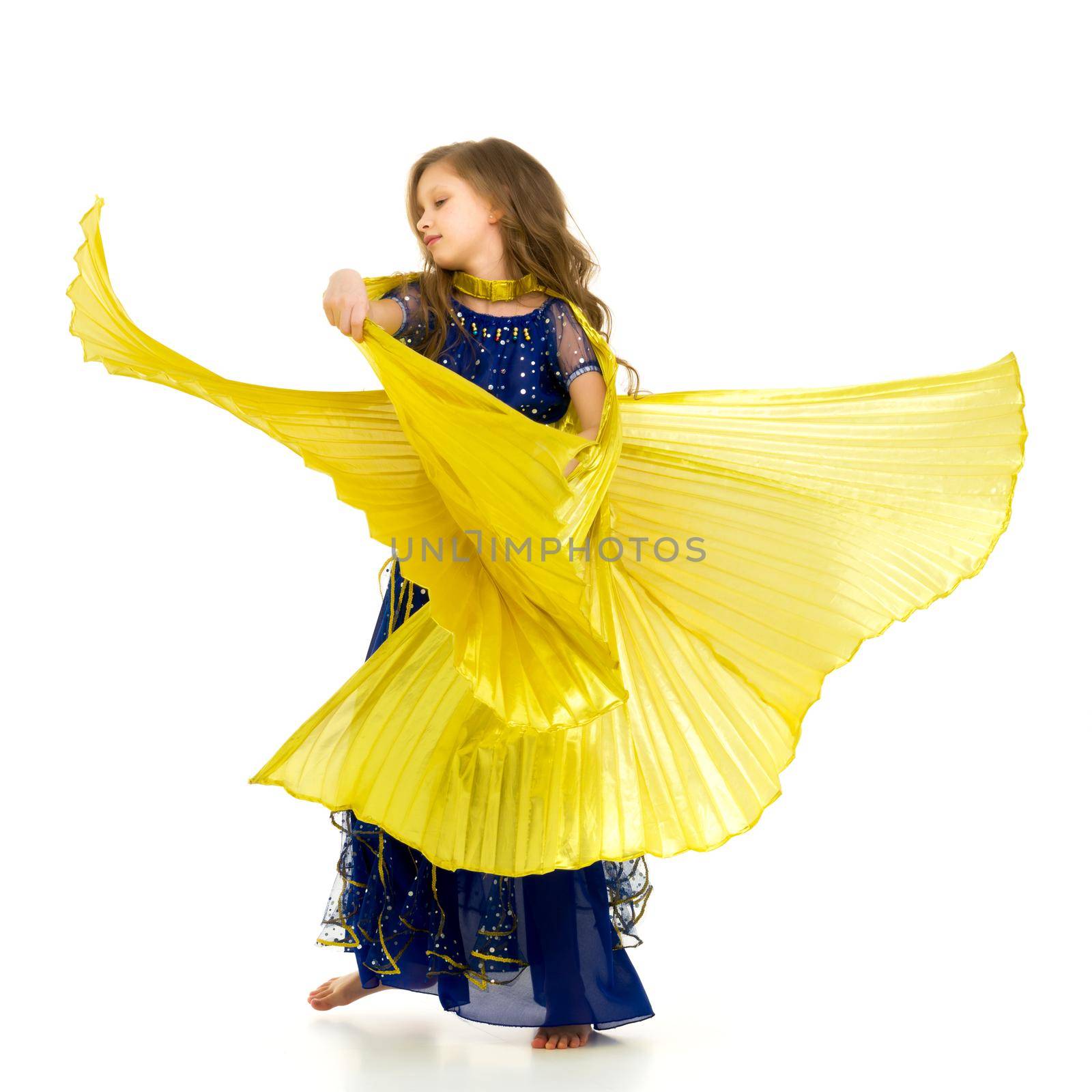 Beautiful Blonde Long Haired Girl Dancing Belly Dance with Wings, Lovely Child in Traditional Blue Decorated Oriental Costume Waving her Yellow Wings in Studio on Isolated White Background