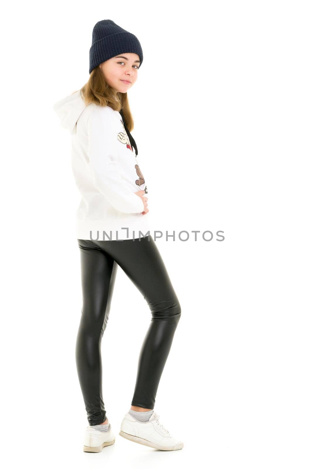 Portrait of a gymnast girl in a tracksuit. Isolated on white background