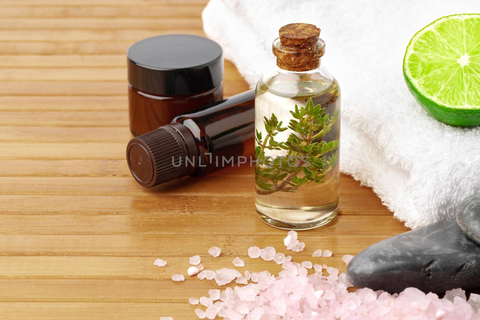 Beauty treatment items for spa procedures on wooden table, close up