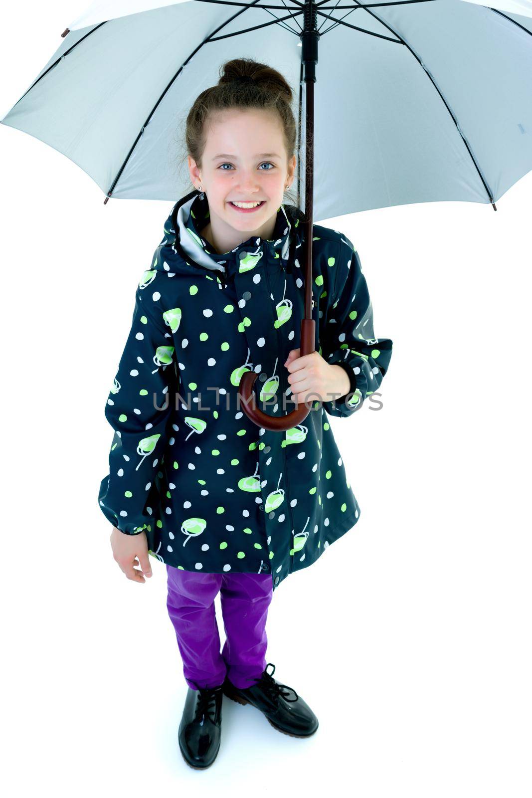 Beautiful little girl with umbrella. Concept of weather, climate change. Isolated on white background