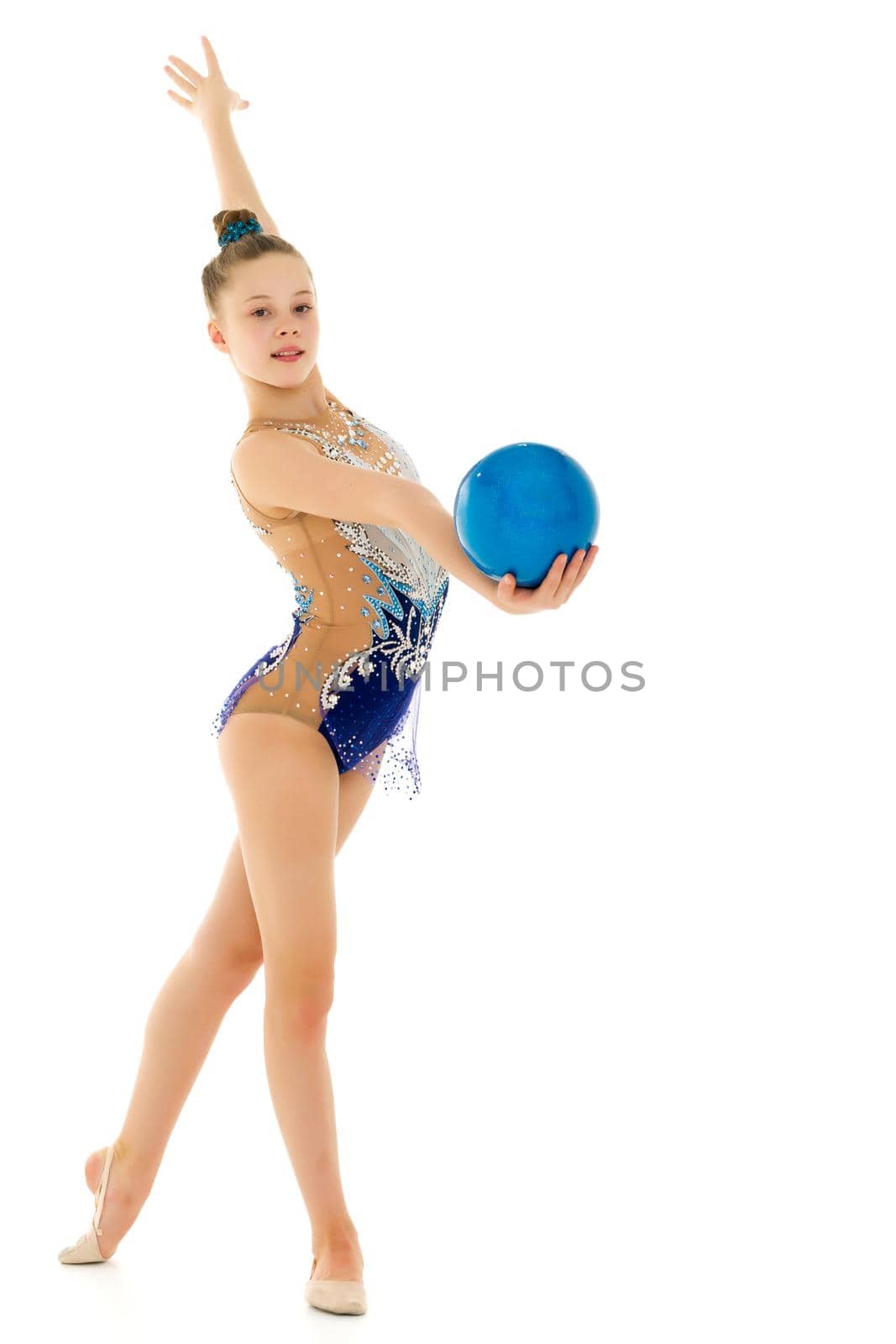 Girl gymnast performs exercises with the ball. by kolesnikov_studio