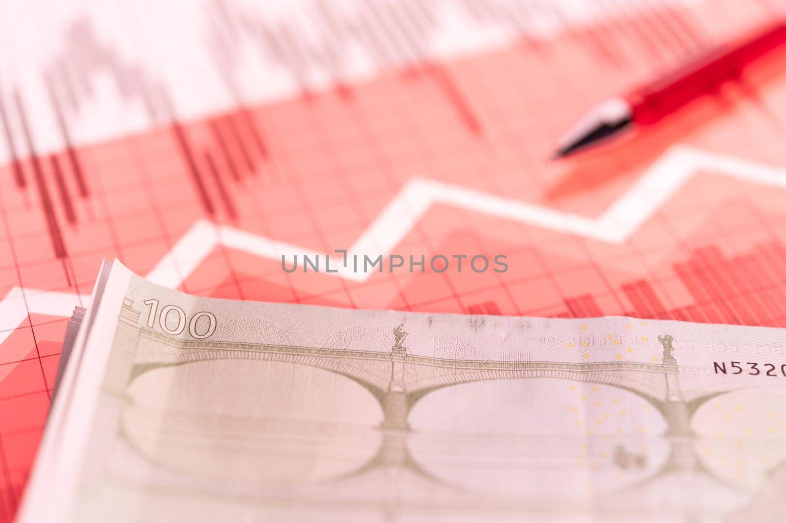 Finance background with money, stock market chart, graph and pen. Economy trends background for business idea and all art work design. Abstract finance and business concept. Living coral toned.