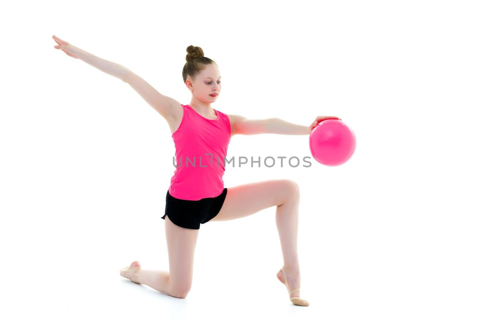 Girl gymnast performs exercises with the ball. by kolesnikov_studio