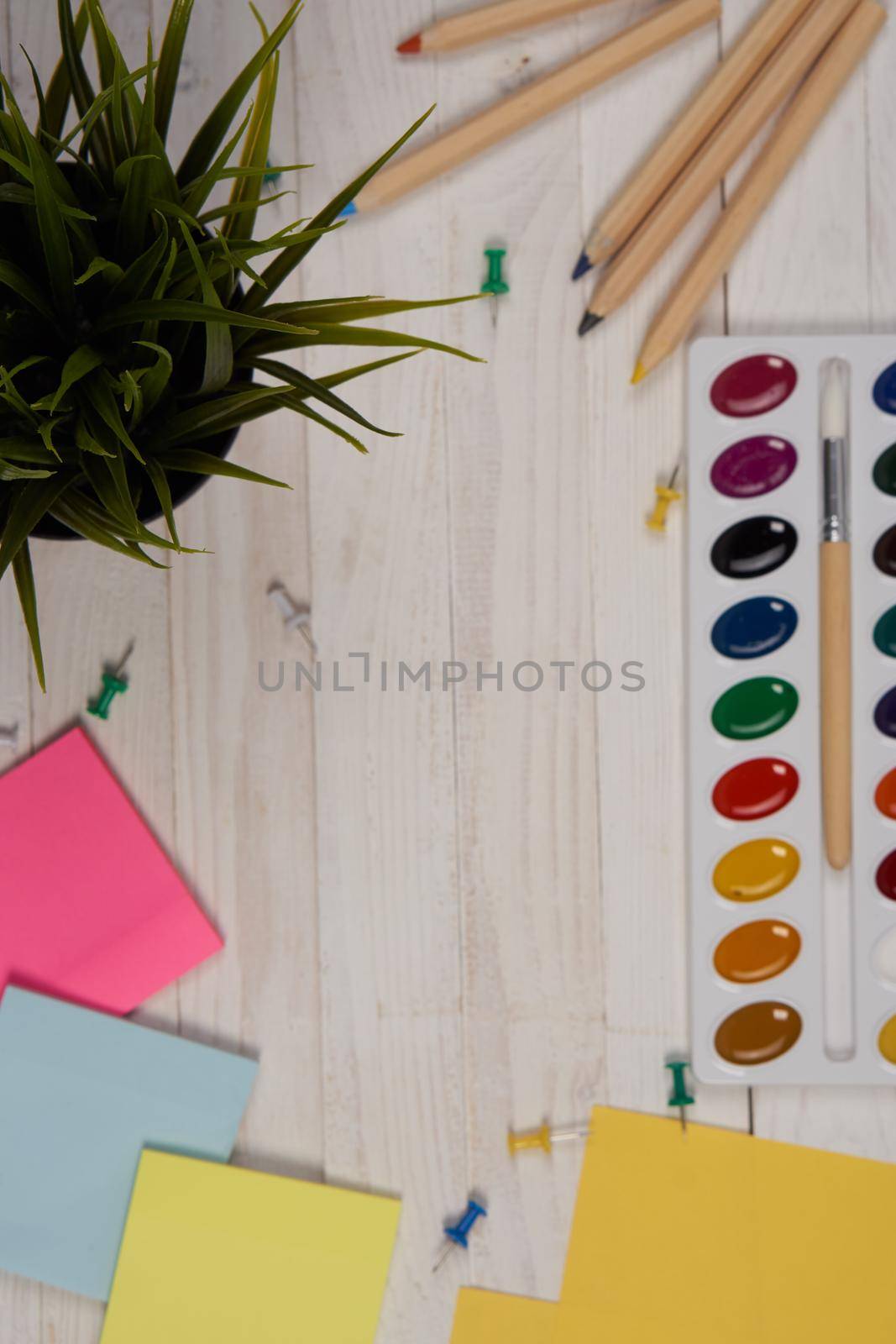 watercolor paint multicolored stickers drawing items wooden background. High quality photo