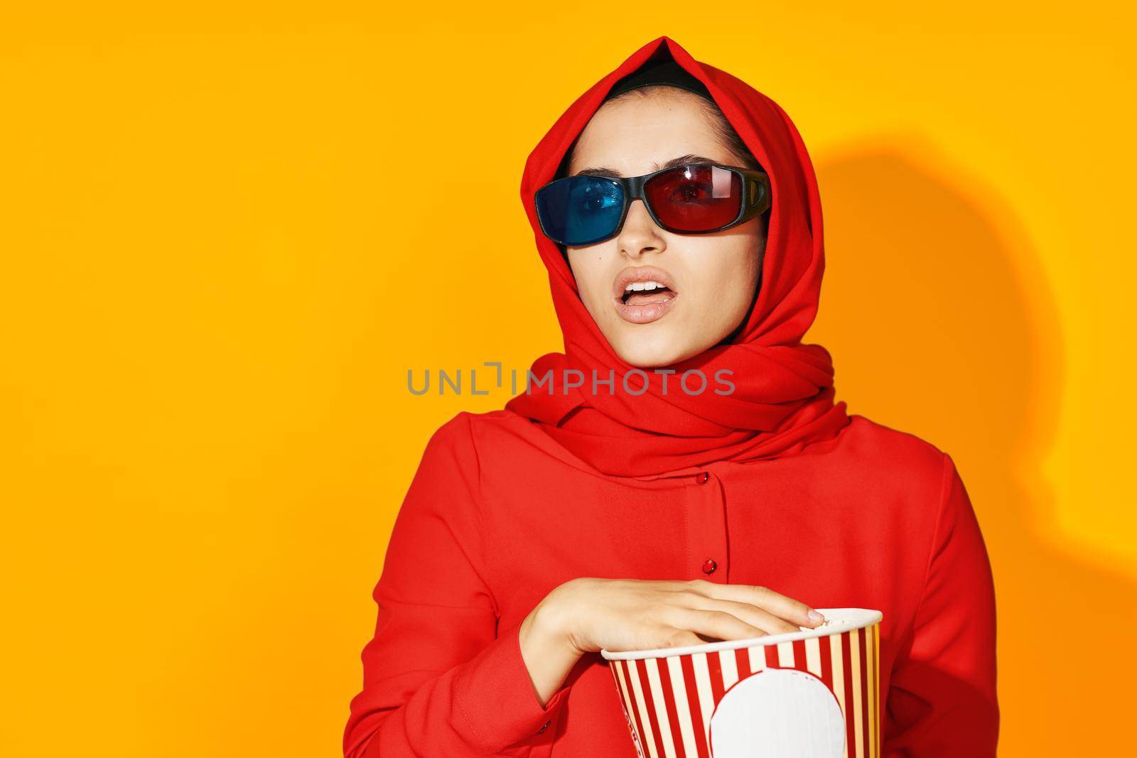 pretty woman virtual reality movie fashion fun movie yellow background. High quality photo