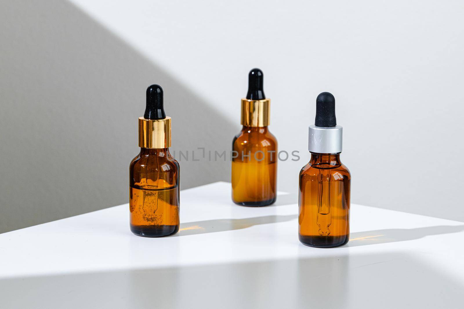 Oily skincare moistrizing brown glass jar with pipette close up