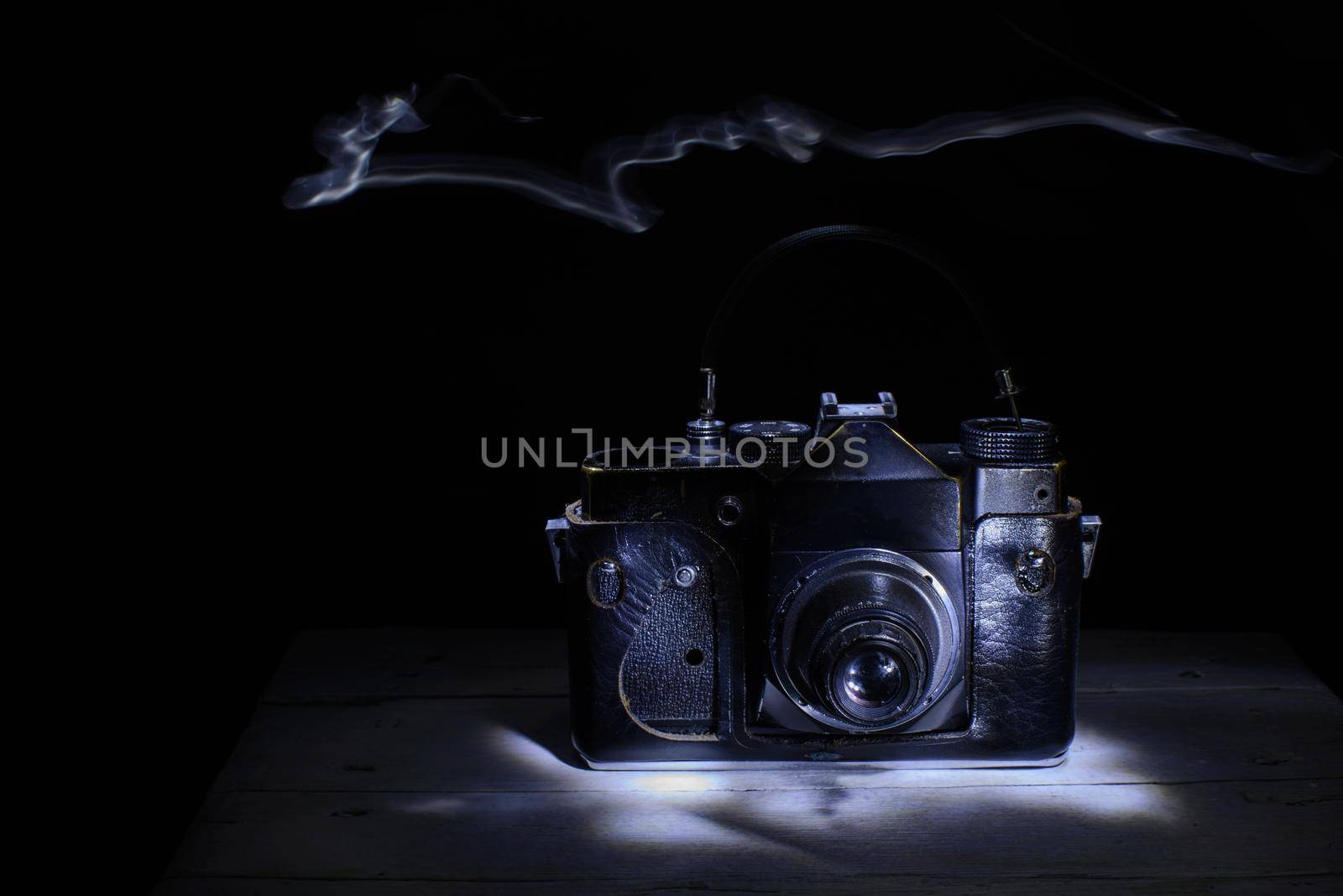 Old retro camera . light brush