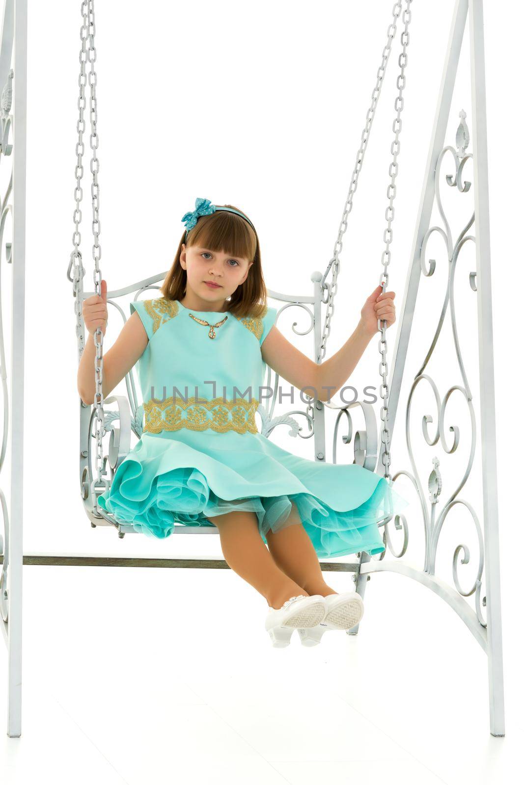 Beautiful teen school girl swinging on a swing. Concept summer vacation. by kolesnikov_studio