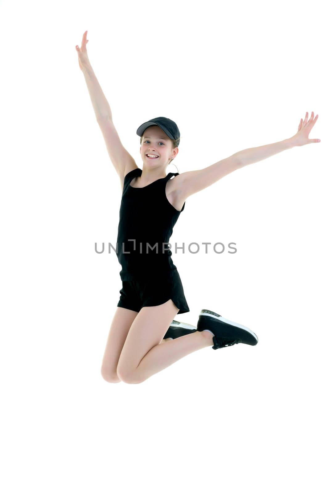 The concept of fitness, gymnastics, sports.The girl gymnast performs a jump. by kolesnikov_studio