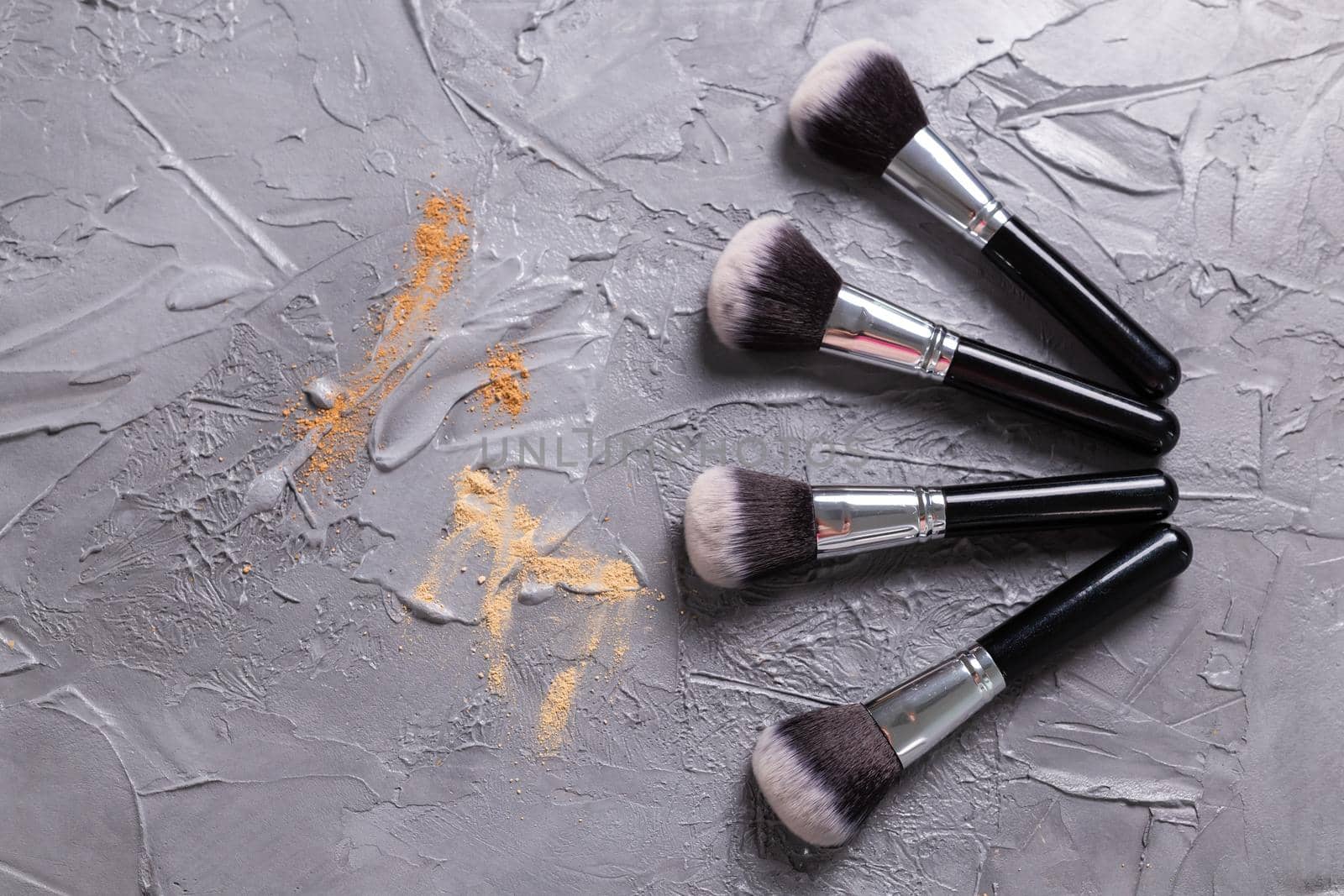 Mineral powder of different colors with a brushes for make-up on wooden background, top view by Satura86