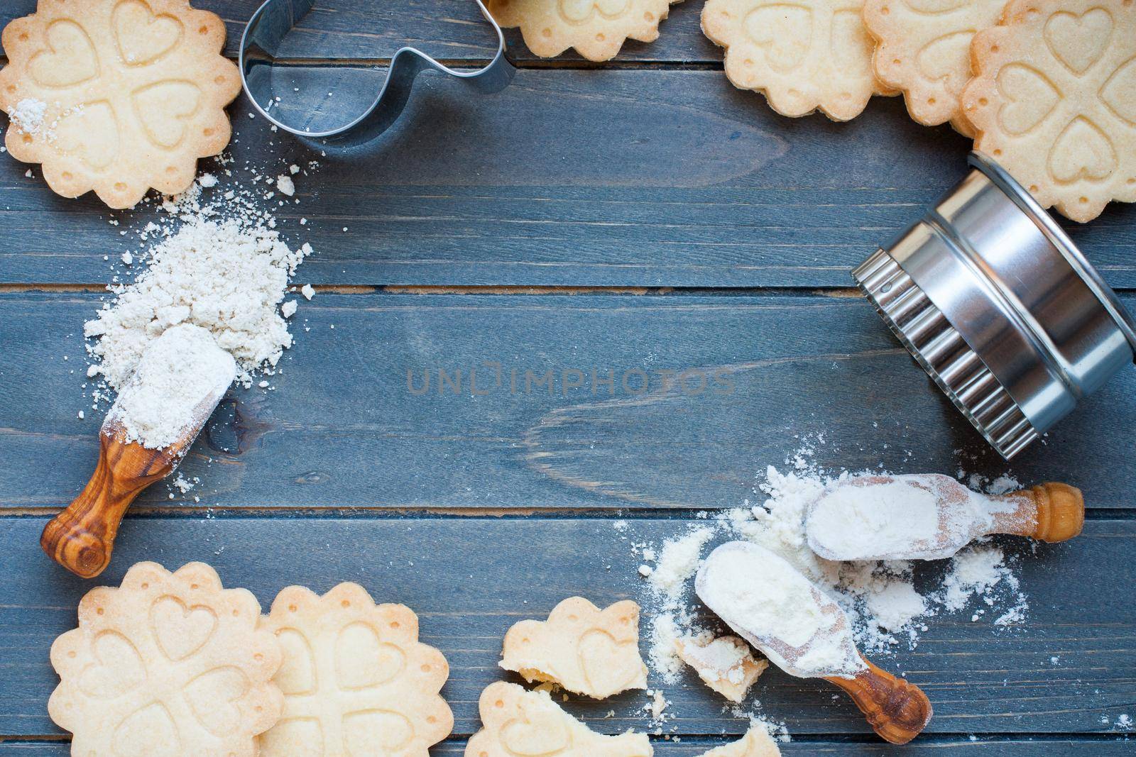Background of baking gluten free shortbread cookies with utensils and ingredients, viewed from above