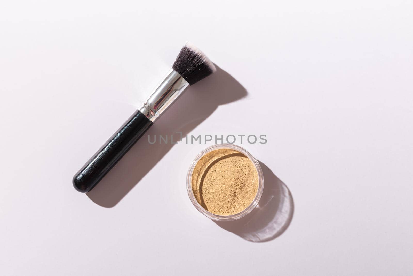 Mineral face powder and brush. Eco-friendly and organic beauty products.