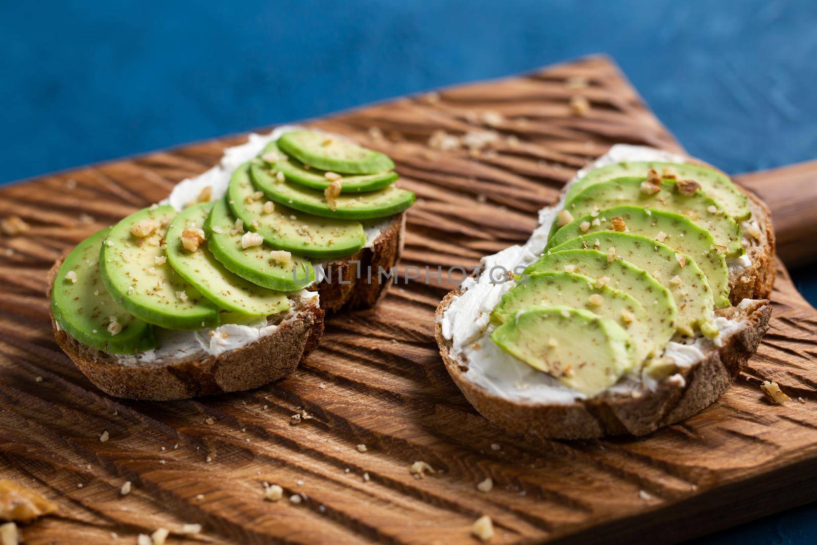 sliced avocado on toast bread with spices.