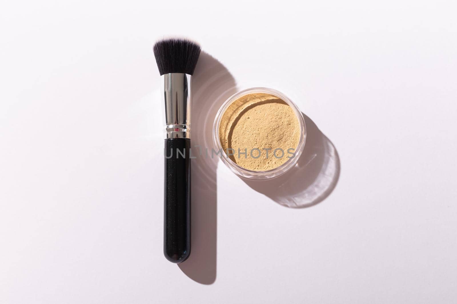 Mineral face powder and brush. Eco-friendly and organic beauty products.