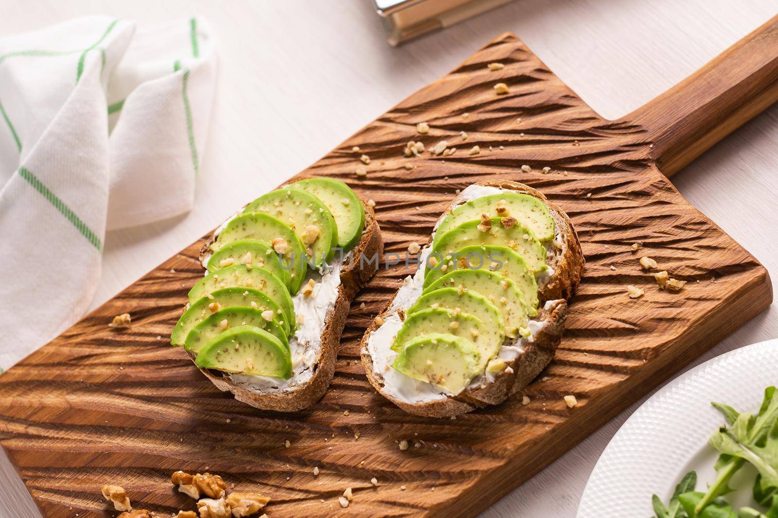 sliced avocado on toast bread with spices.