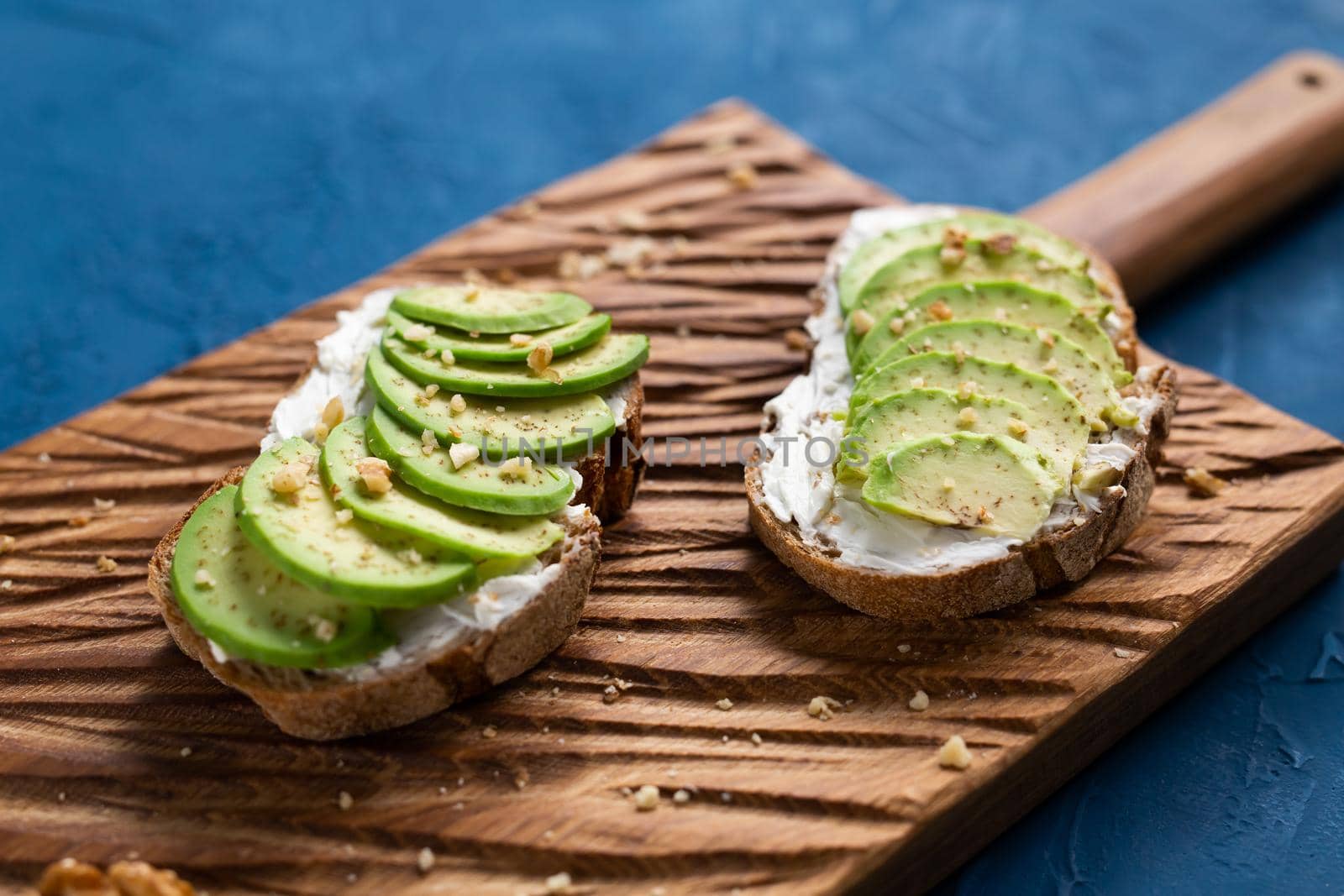 sliced avocado on toast bread with spices.