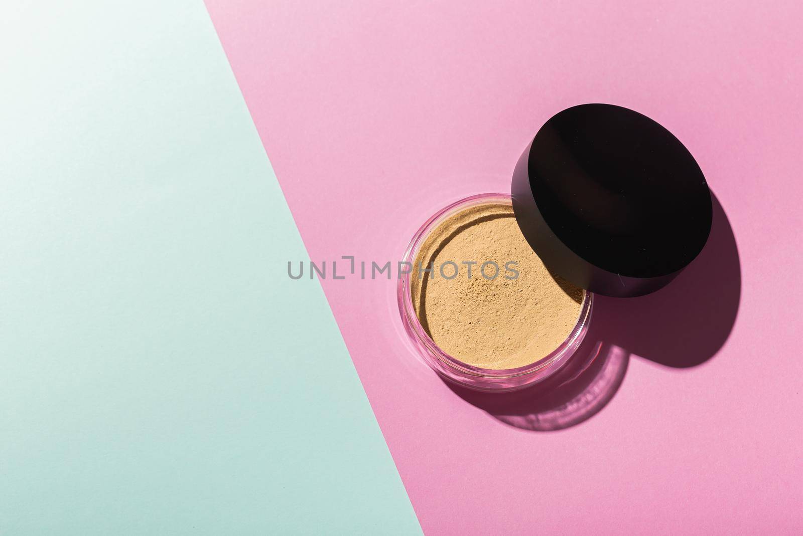 Mineral powder foundation isolated on a white background. Eco-friendly and organic beauty products.