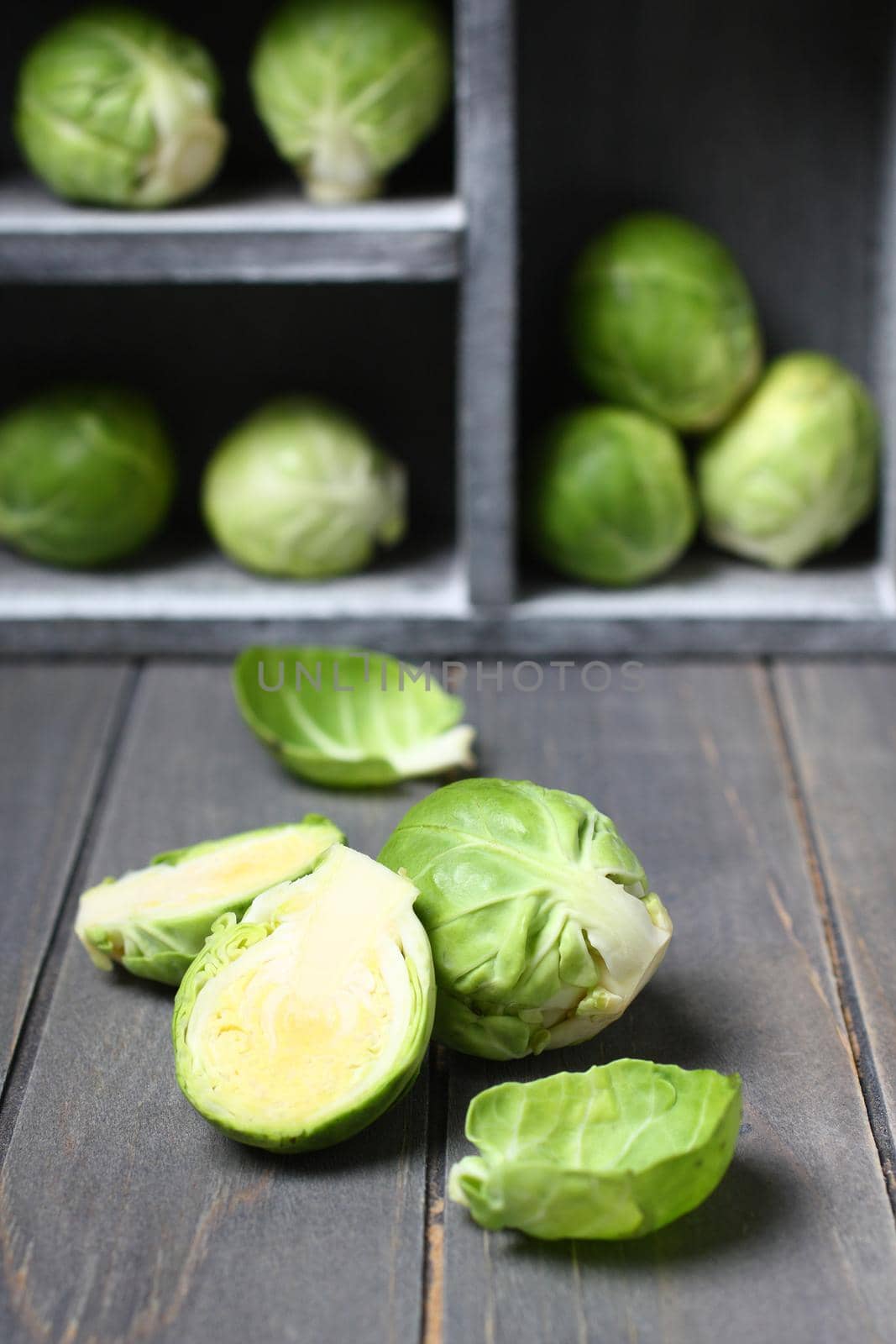 Fresh raw brussels sprouts on a wooden table