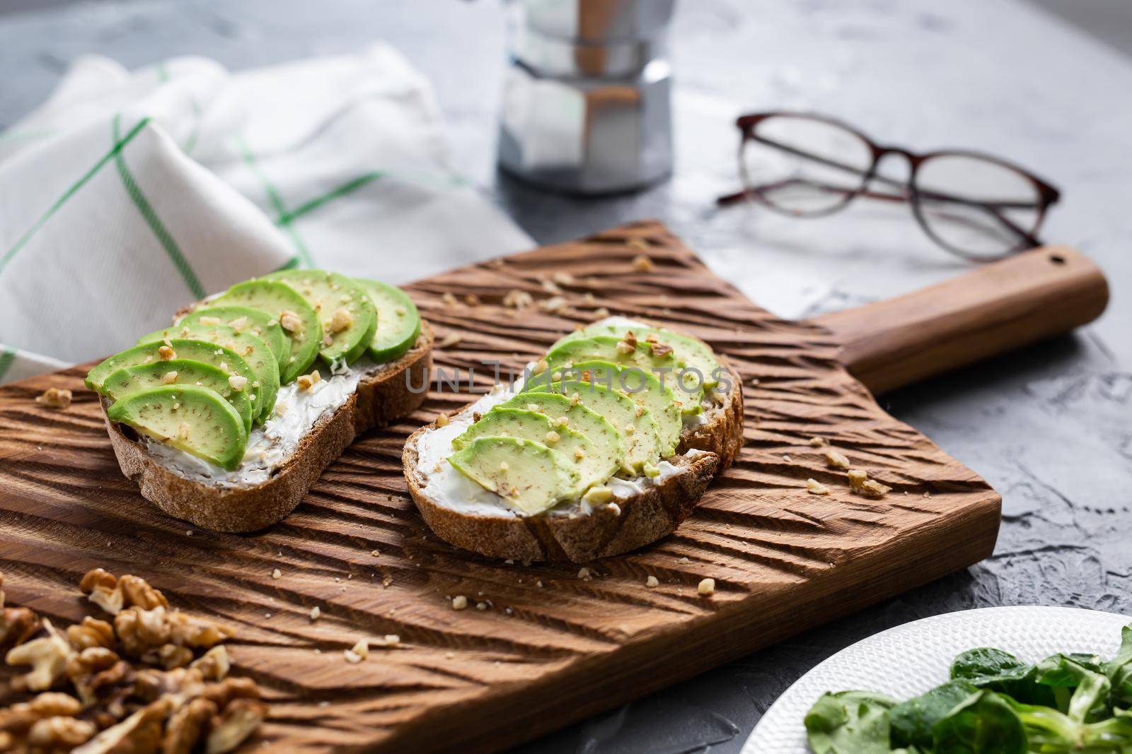 sliced avocado on toast bread with spices.