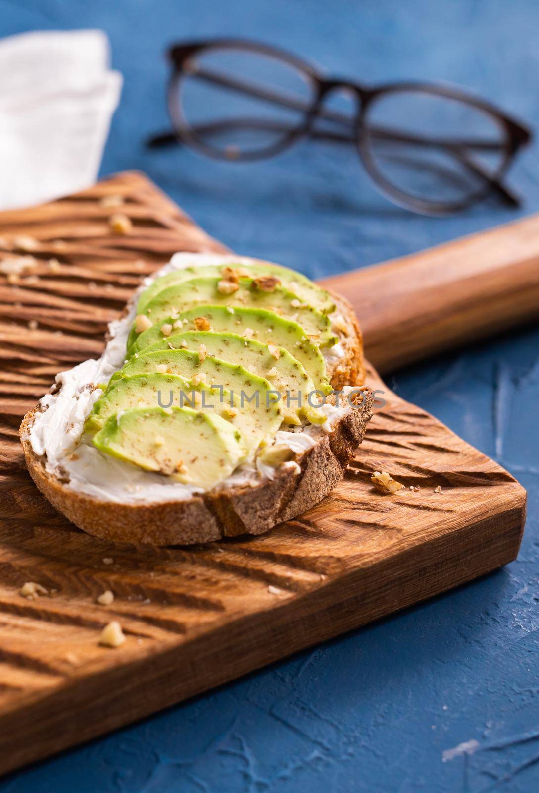 Avocado sandwich on dark rye bread made with fresh sliced avocados from above